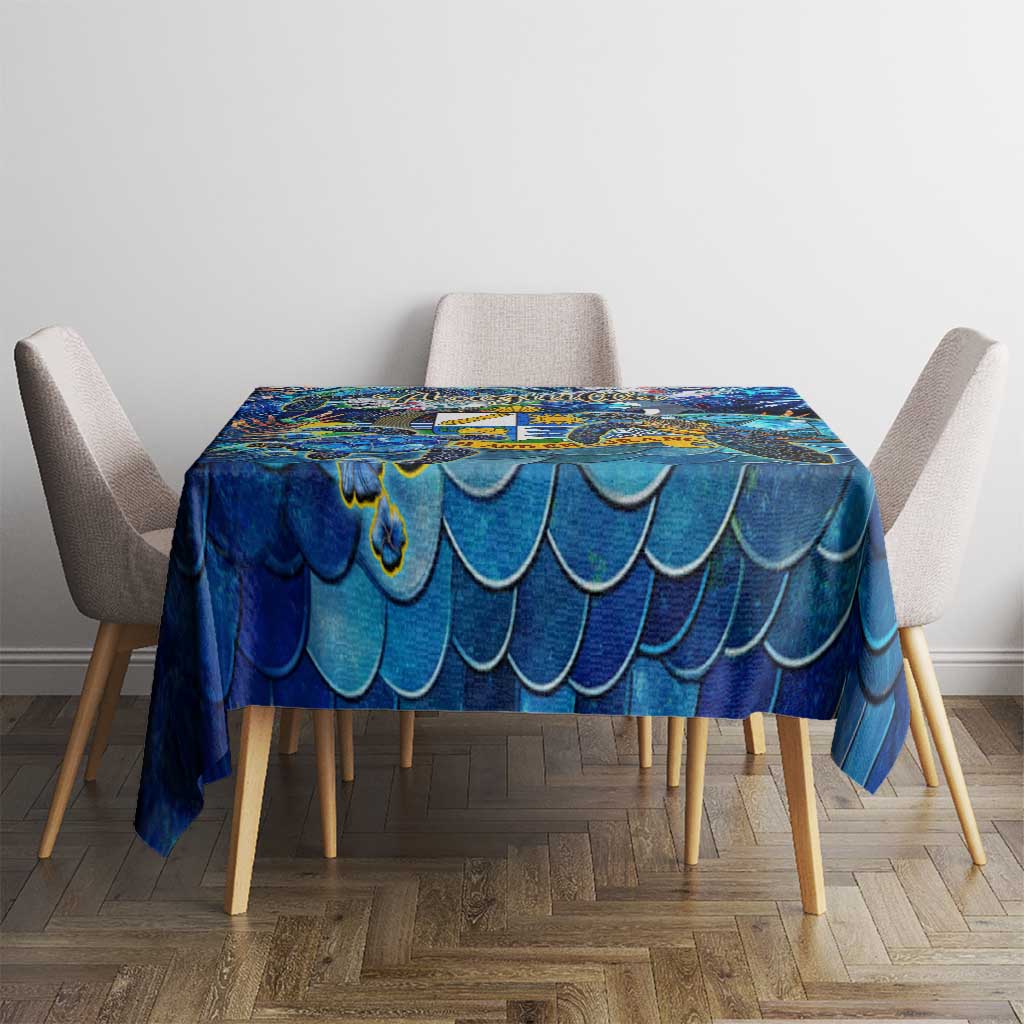 Blue ocean-scale tablecloth covering a square dining table
