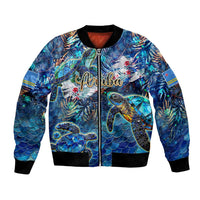 Blue bomber jacket with sea turtle tropical print, zip front, ribbed black cuffs and hem