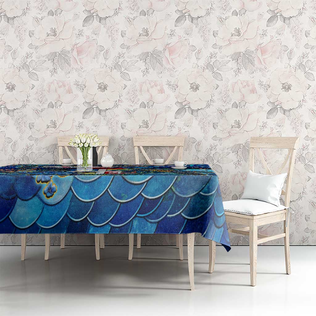 Blue sea turtle tablecloth with scalloped scales pattern on dining table and chairs