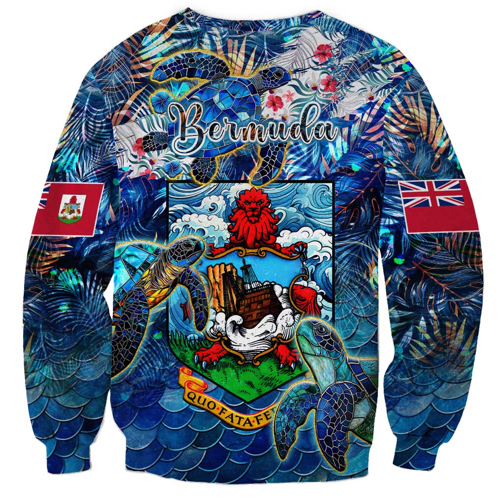 Blue crewneck sweatshirt with sea turtles and central crest graphic, tropical sleeves