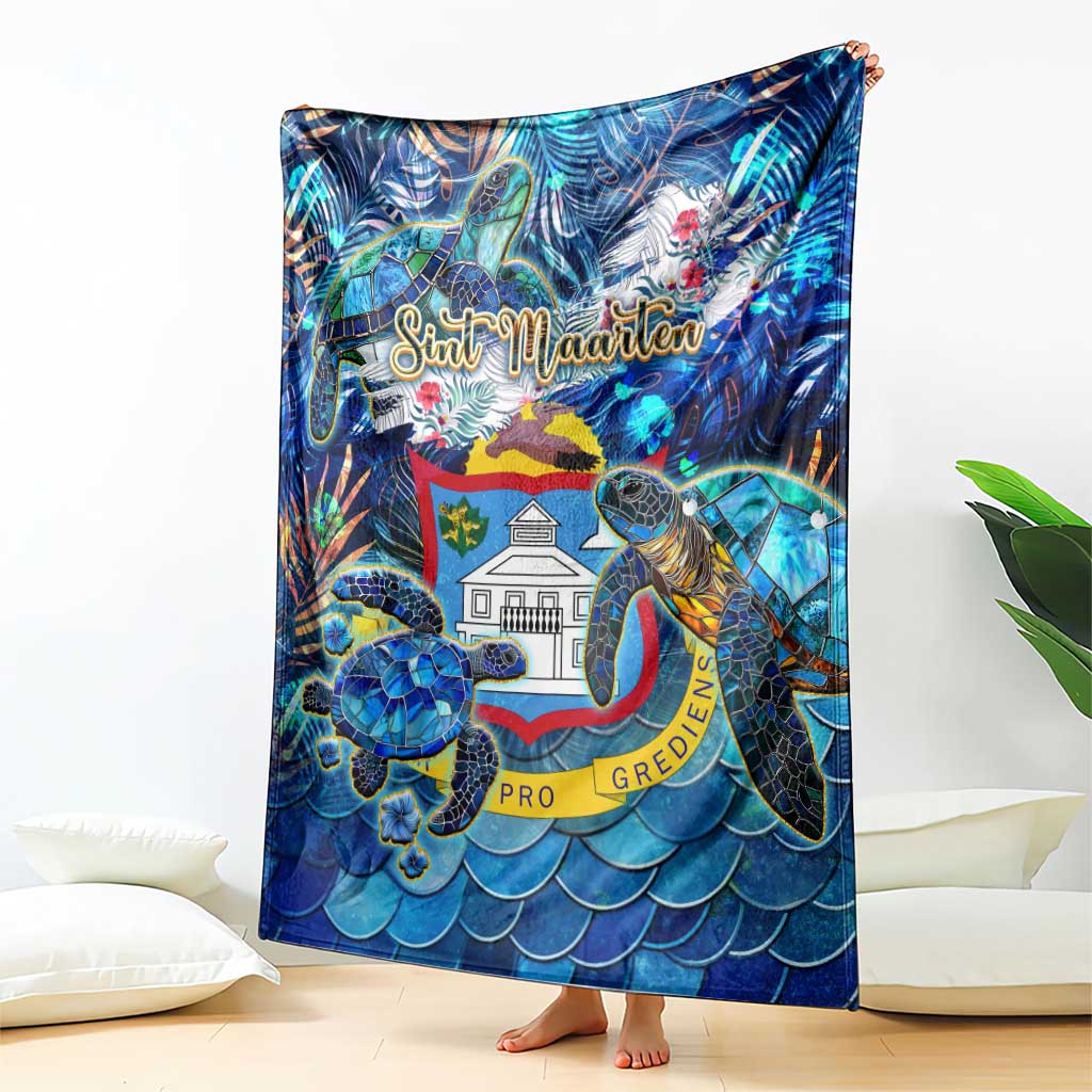 Blue sea turtle tropical blanket draped on bed, featuring Sint Maarten graphic