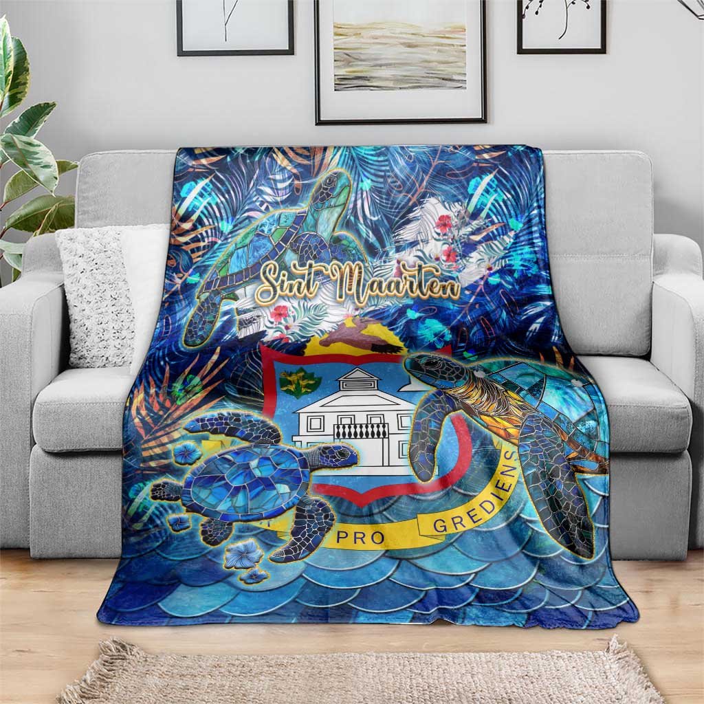 Blue sea turtle tropical blanket on sofa with Sint Maarten crest and wave scales
