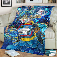 Blue sea turtle tropical blanket with Sint Maarten text, turtle, and wave scales