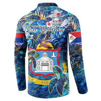 Blue button-collar sweatshirt with large sea turtle and building graphic on back, tropical print