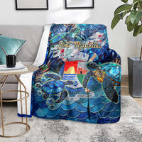 Blue sea turtle tropical blanket spread on floor, sea turtle wave-scale artwork
