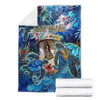 Blue sea turtle tropical blanket folded, colorful turtle scene shown with white rolled towels
