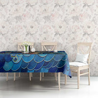 Blue sea turtle tropical pattern tablecloth on dining set against light floral wall