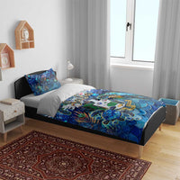 Blue sea turtle tropical duvet set on bed with two matching blue pillowcases