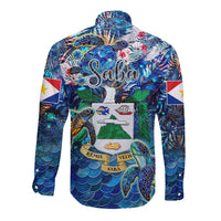 Blue long-sleeve button shirt with sea turtle tropical print and map crest graphic