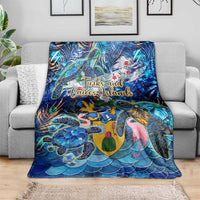 Blue sea turtle blanket with “Turks and Caicos Islands” text, multicolor turtle and fish artwork