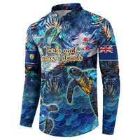 Blue button sweatshirt front with sea turtle, tropical plants, and island-style text