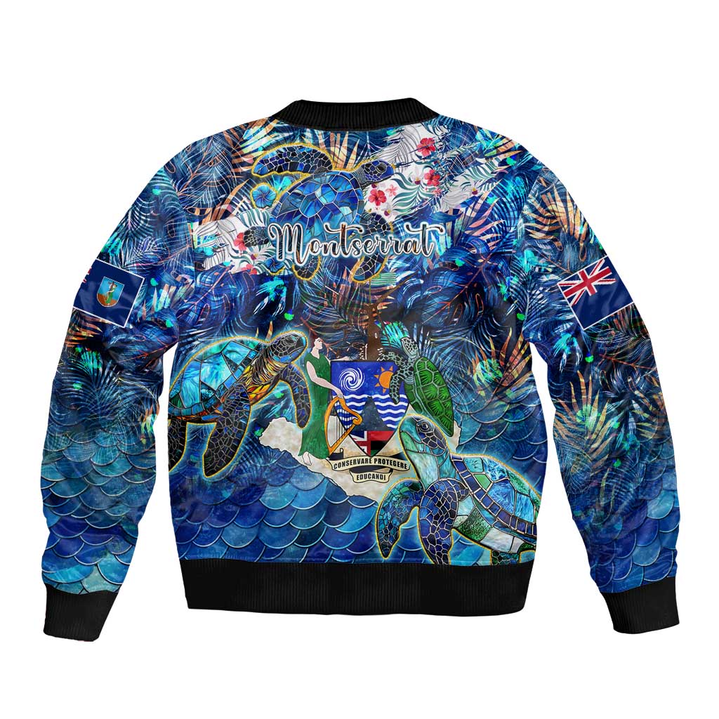 Unisex blue bomber jacket with sea turtle tropical print, back graphic with logo, black ribbed hem