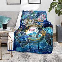 Blue sea turtle tropical blanket spread on a living room sofa with scale pattern