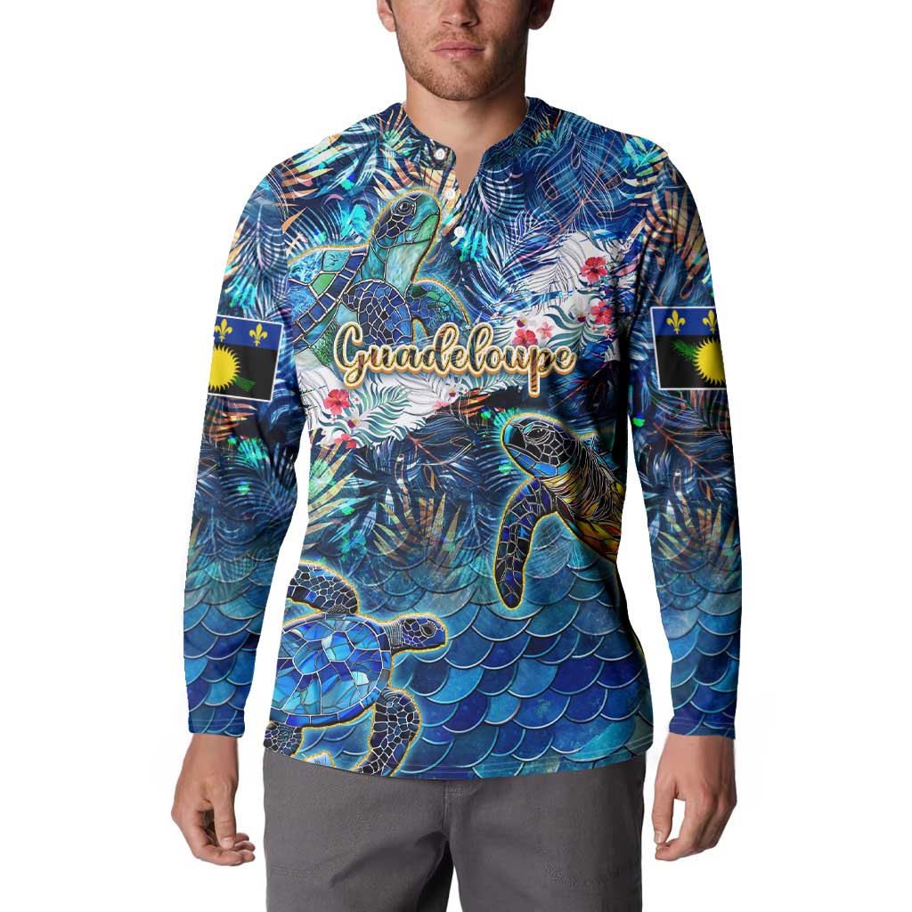Sea turtle button sweatshirt on model, dark blue tropical print with chest “Guadeloupe”
