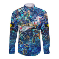Blue long-sleeve button-up shirt with sea turtle tropical print, front graphic