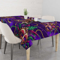 Purple glitter tablecloth with ornate mask and scrolling paisley motifs, corner view