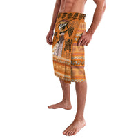 Knee-length patterned lavalava skirt in orange, black, and gold tribal print