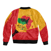Multicolor bomber jacket back with Black History Month text, February label, and map graphic
