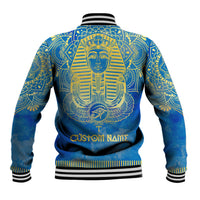Blue baseball jacket back with gold pharaoh artwork and Custom Name text, striped rib trim