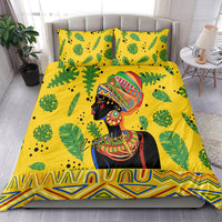 Yellow bedding set featuring green leaves and colorful portrait graphic, with matching pillowcases