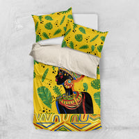 Yellow duvet and pillowcases set with green leaf pattern and illustrated African woman figure