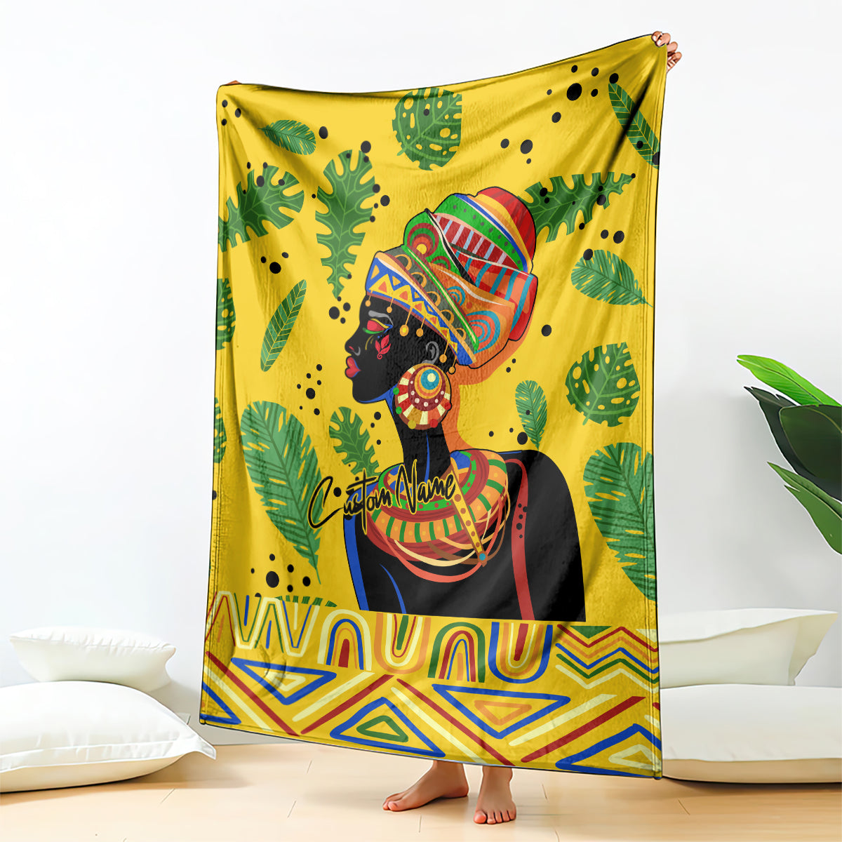 Yellow blanket featuring a woman portrait with colorful headdress, tropical leaves, zigzag hem