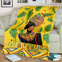Yellow tropical blanket with woman portrait and green leaf pattern, bordered with zigzags