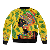 Yellow bomber jacket with tropical leaf pattern and African woman artwork, front zip.