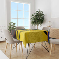 South Africa coat of arms tablecloth draped on dining table, yellow and green flag-style print