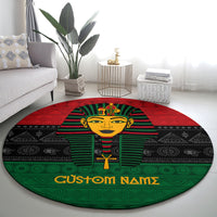 Round pharaoh area rug with red, green, and black design and 'Custom Names'
