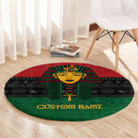 Round pharaoh-themed rug with red-green-black palette and 'Custom Names' border text