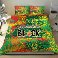 Green, red, and yellow bedding set with bold black lettering on duvet and pillowcases