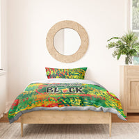 Colorful green duvet bedding set with bold black graphic lettering, no pillow shams visible
