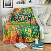 Personalized throw blanket, green with red-orange graphics and bold black BLK text.