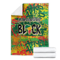 Personalized throw blanket, folded, green-red graphics with bold black BLK text and towels.