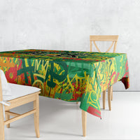 Colorful green tablecloth draped over dining table with side overhang