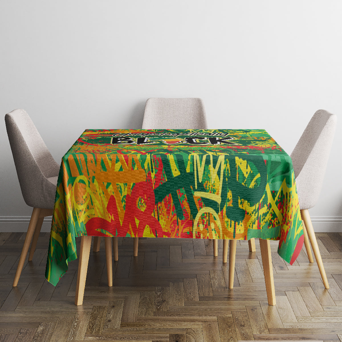 Square green African-inspired tablecloth with colorful lettering on a dining set
