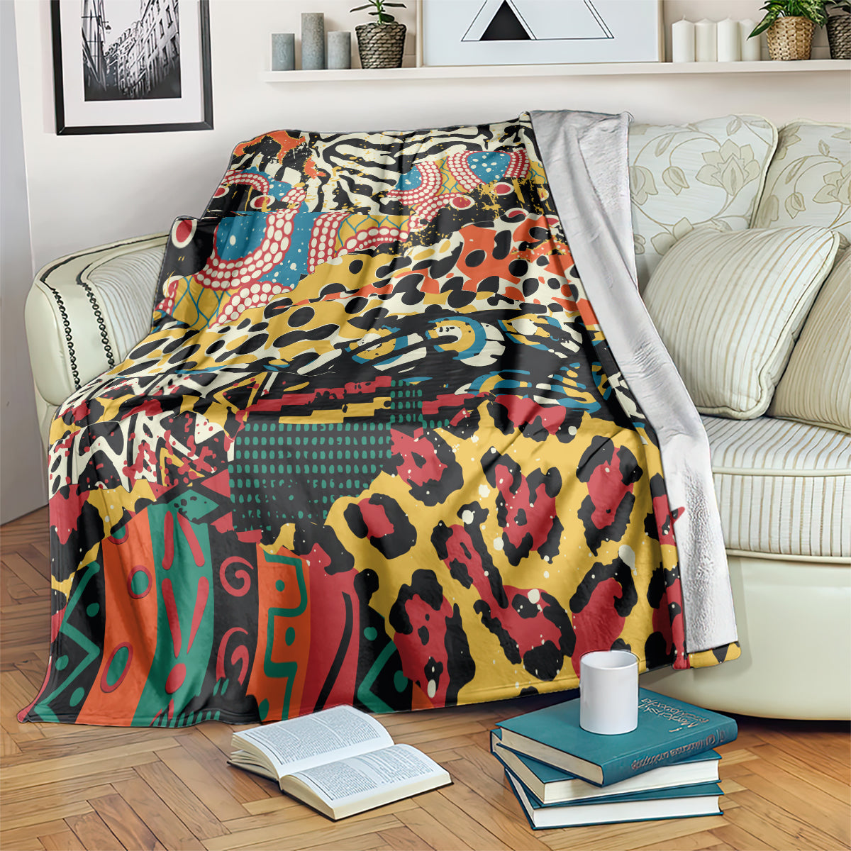 Colorful animal-pattern fleece blanket draped over couch, multicolor abstract design.