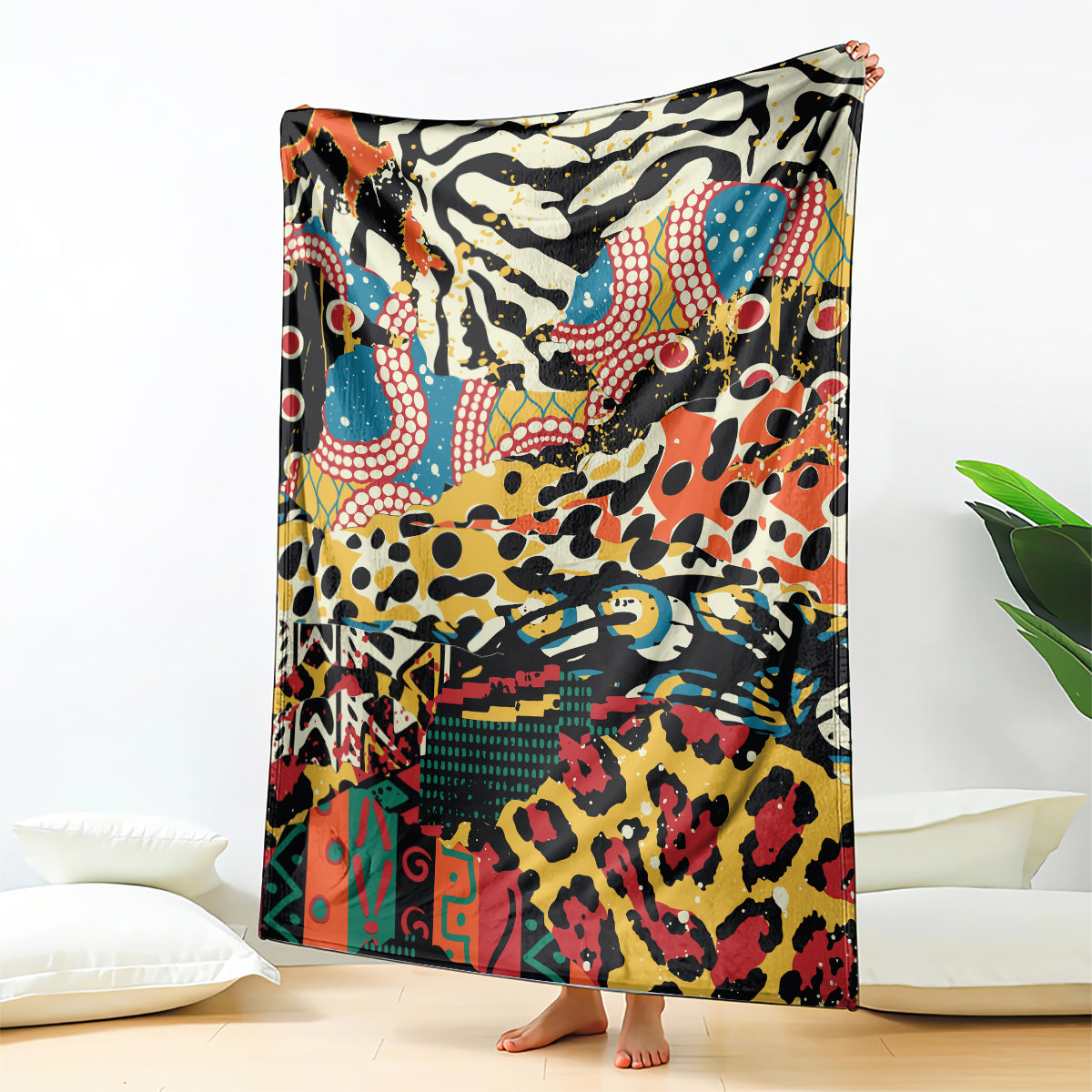 Multicolor animal-pattern fleece blanket hanging, bold abstract figures and shapes.