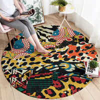 Round area rug with bold animal and tribal pattern in black, orange, blue, red