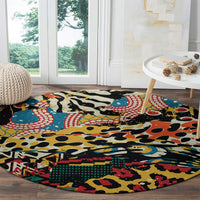 Round area rug featuring multicolor animal and abstract pattern with black base