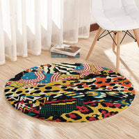 Round area rug with vibrant animal pattern in black, blue, red, yellow on oval shape