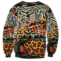 Crewneck sweatshirt in teal, black, red with bold animal collage pattern