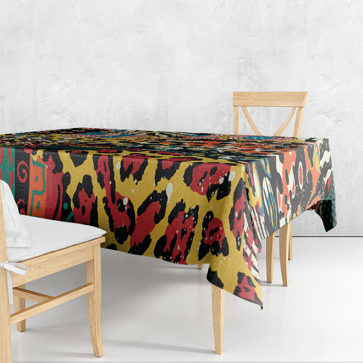 Colorful animal-pattern tablecloth draped over the edges of a dining table