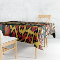 Colorful animal-pattern tablecloth draped over the edges of a dining table