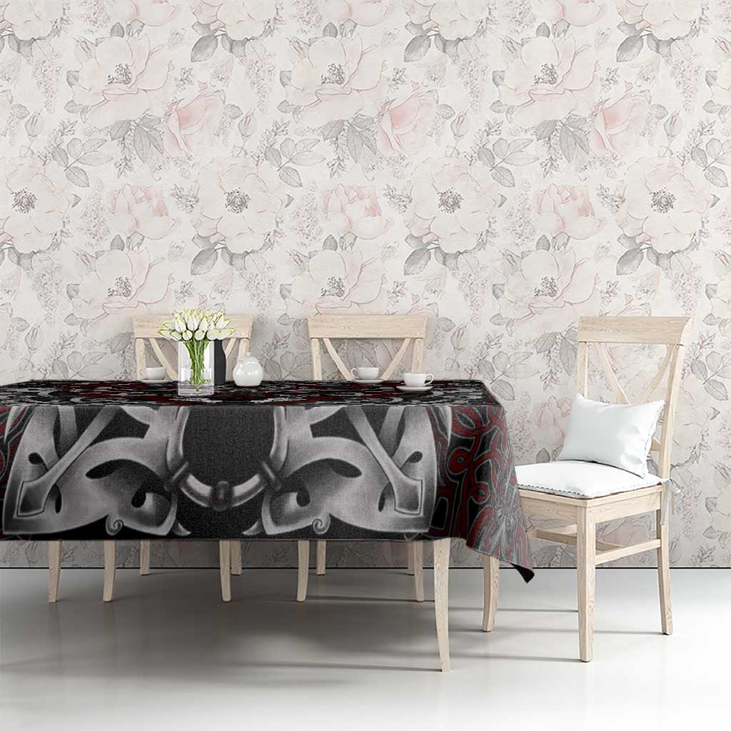 Viking wolf tablecloth, dark gray with red knotwork and wolf head motif on tabletop.