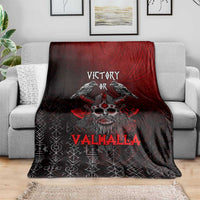 Viking blanket draped over sofa, black and red with ravens, skull face, and 'Valhalla'.