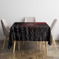 Black square tablecloth with geometric rune and red pattern, straight drape on table