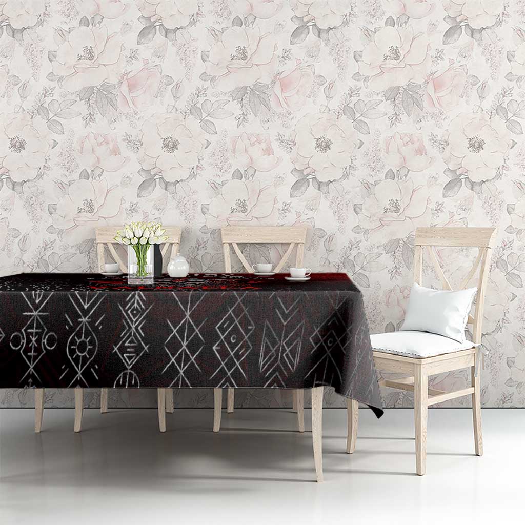 Black tablecloth with rune motifs and red accents, styled on dining table with chairs