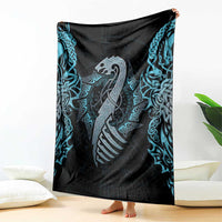 Folded dragon motif blanket, black with blue teal runes and knot designs